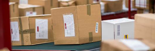 Cardboard boxes packages on conveyor belt 