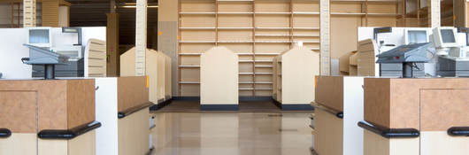 An empty retail store with checkered floors