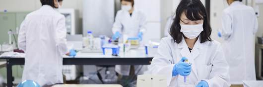 Life sciences laboratory technicians in Asia.