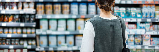 Person looking at shelves of products in a grocery store