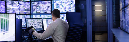 A person working in a surveillance room