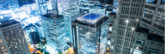 high rises with binary code swirling around buildings