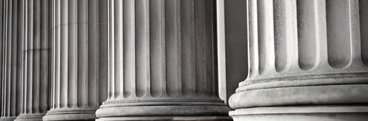 Closeup of columns in front of a building