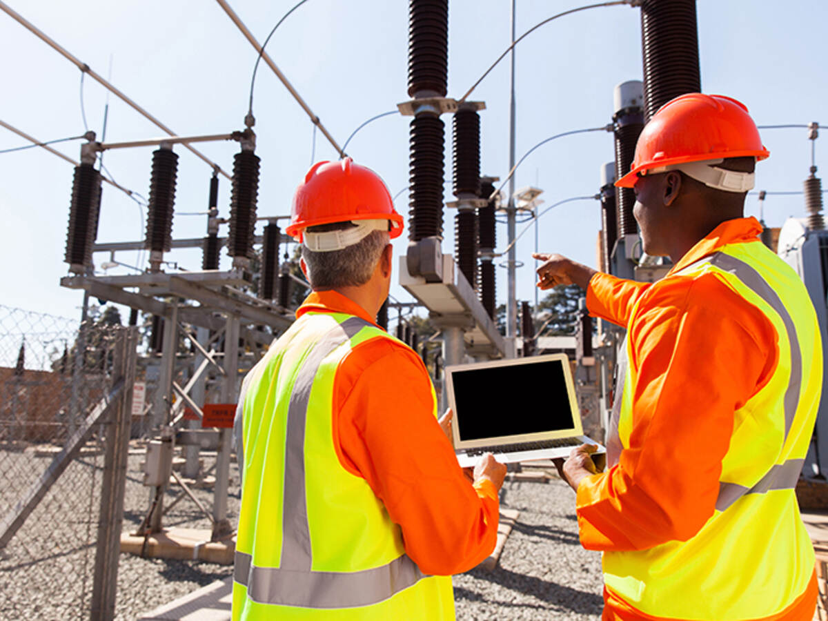 power workers on laptop