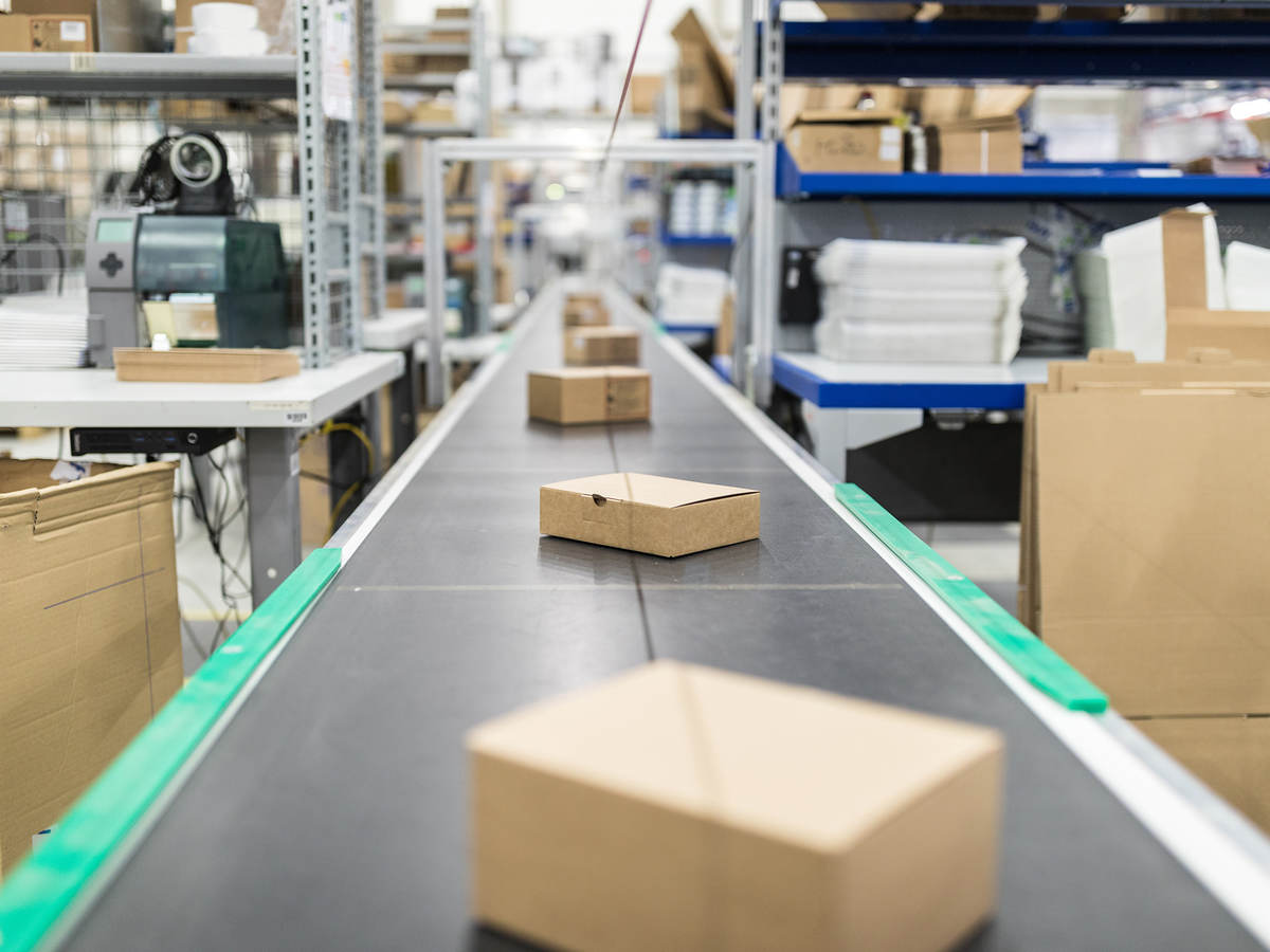 Photo of cardboard boxes on a conveyor belt