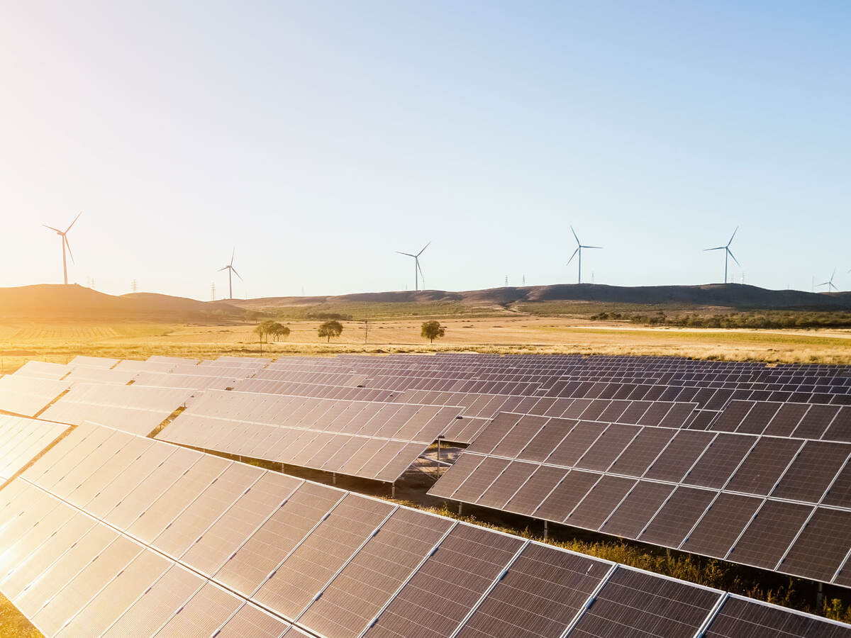 Sunrise on a solar and wind farm