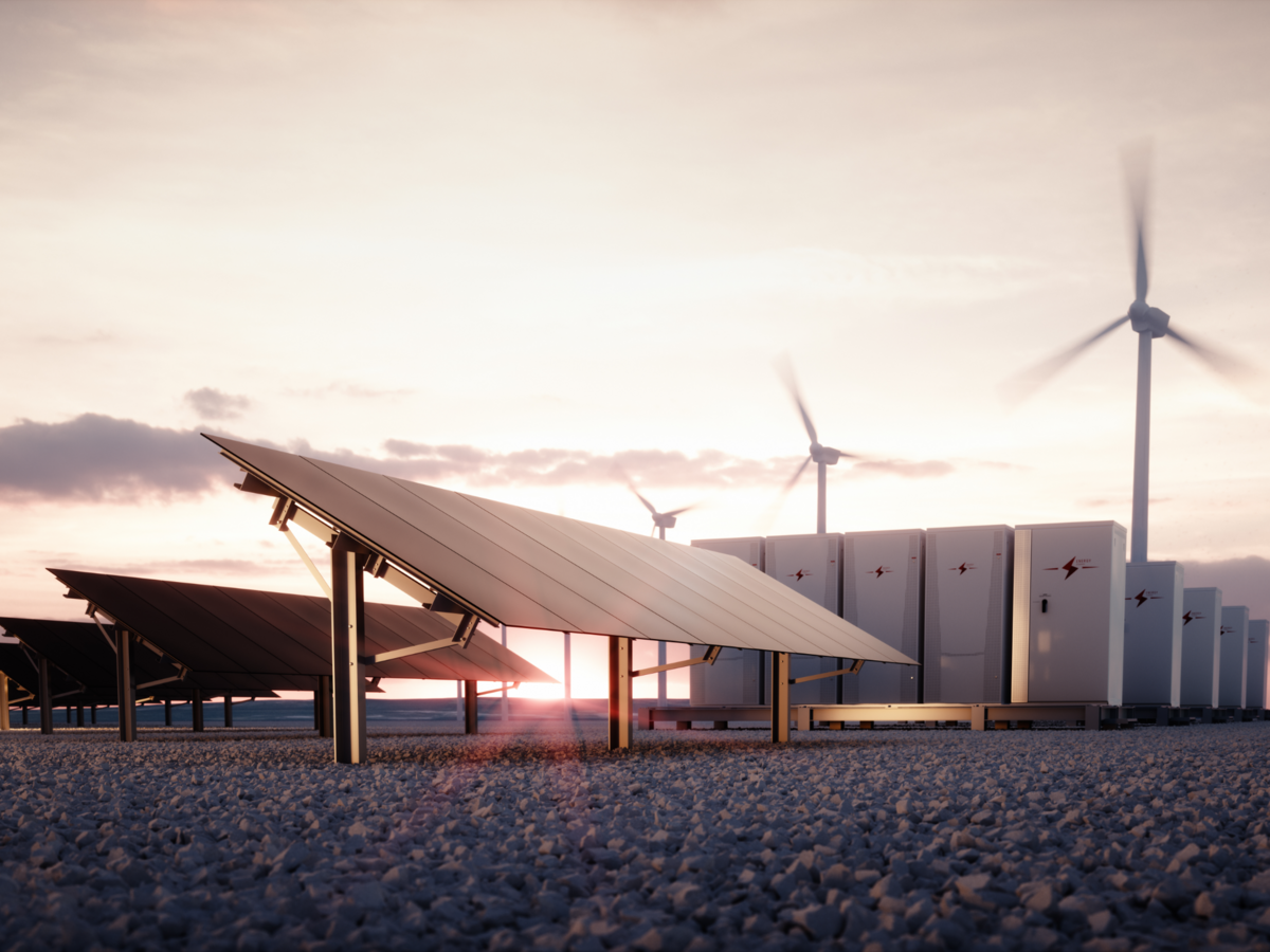 Solar panel and battery field at dusk