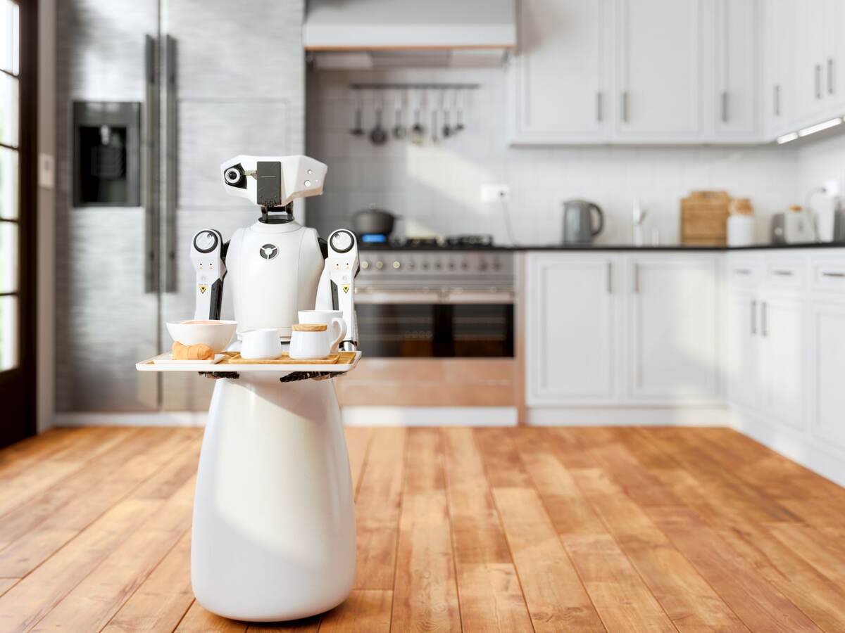 Serving robot holding tray in a kitchen.