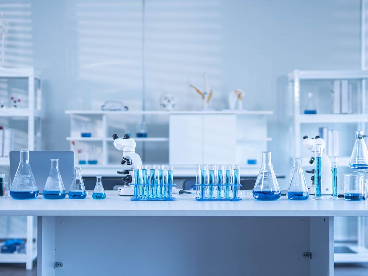 Modern empty science laboratory with microscopes, test tubes and other laboratory equipment.