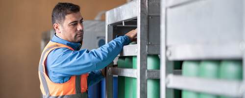 Engineer checking gas cylinders