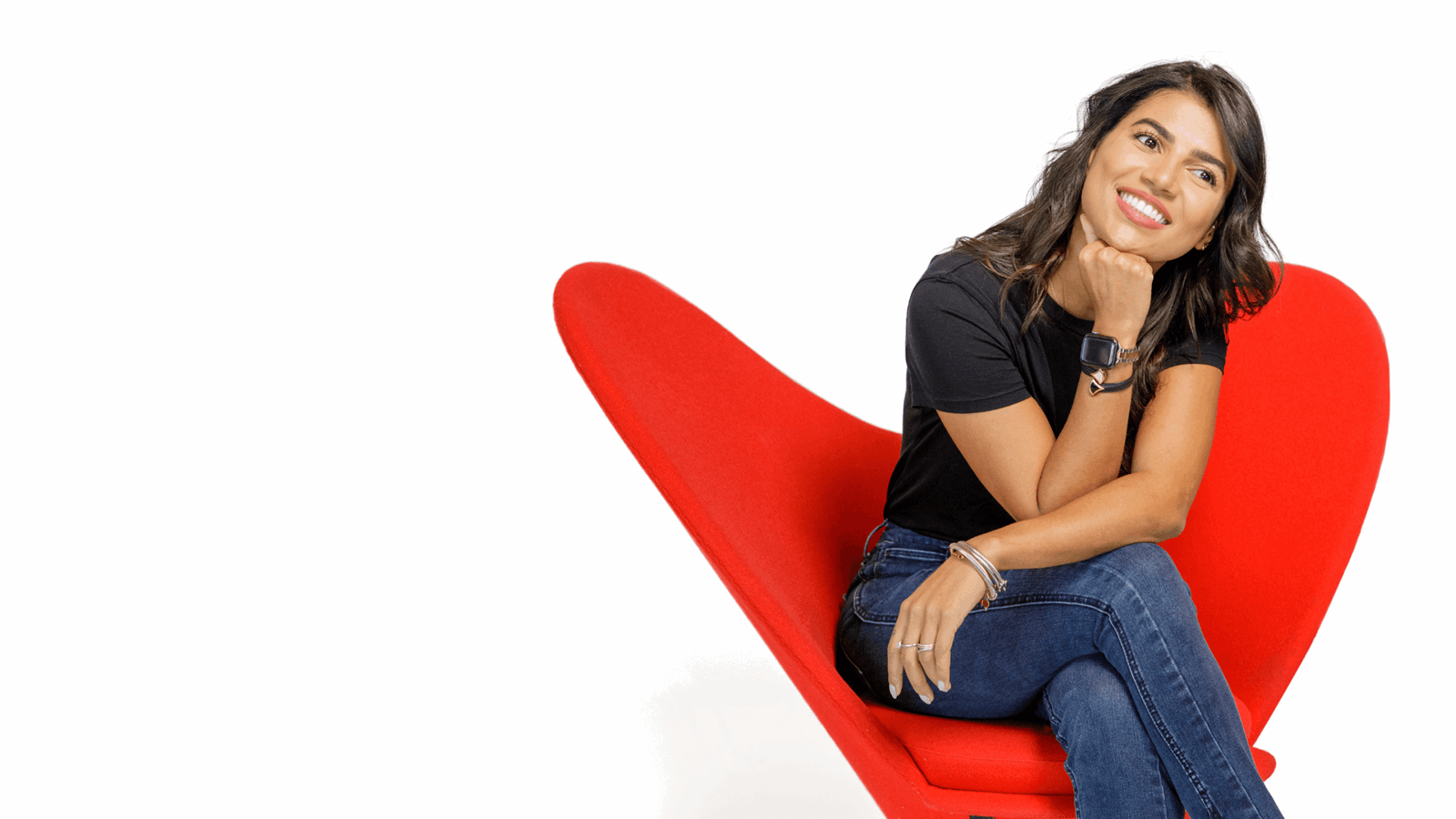 Young Marketing Professional Resting In Red Chair In Photo Studio