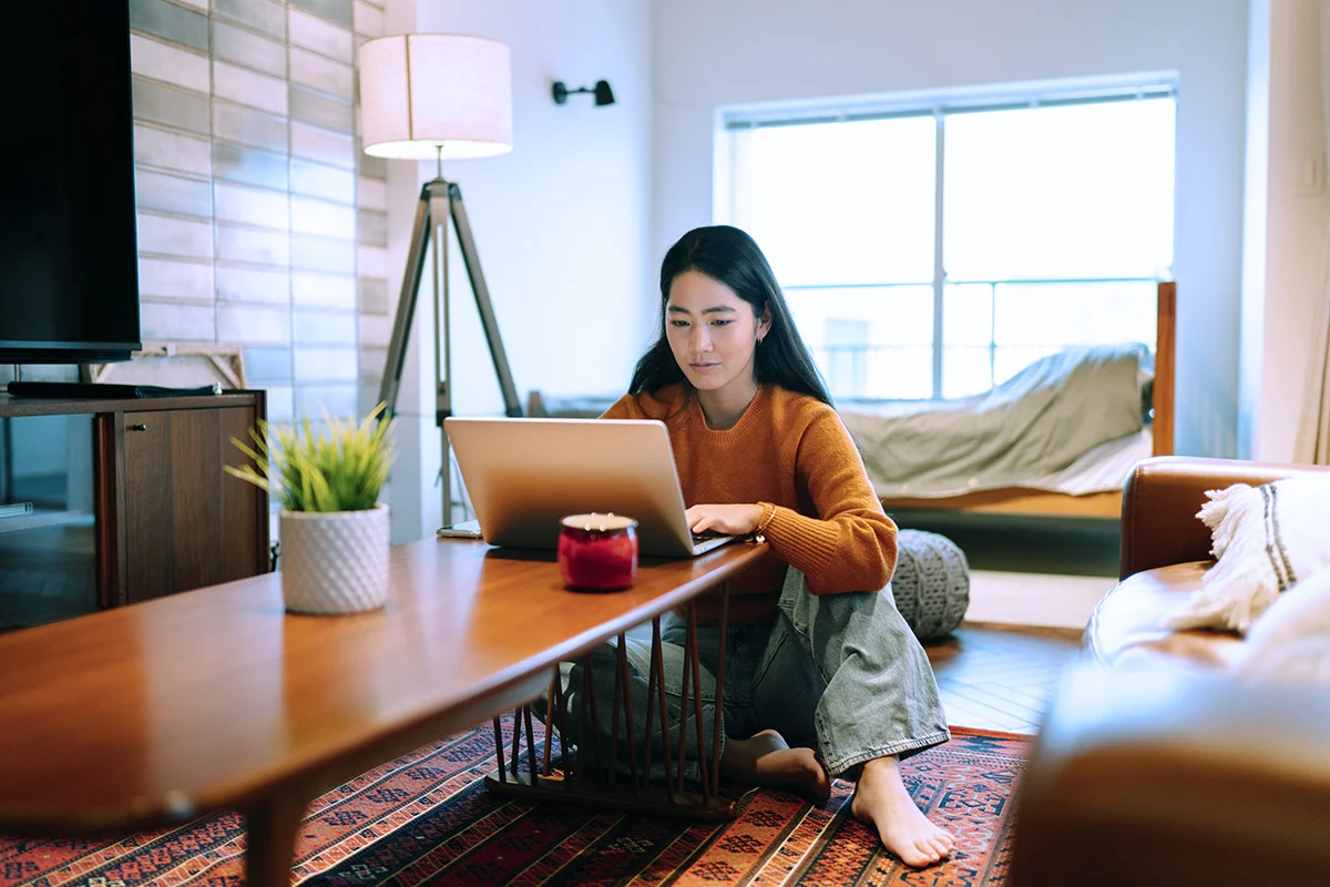 woman using a laptop at home