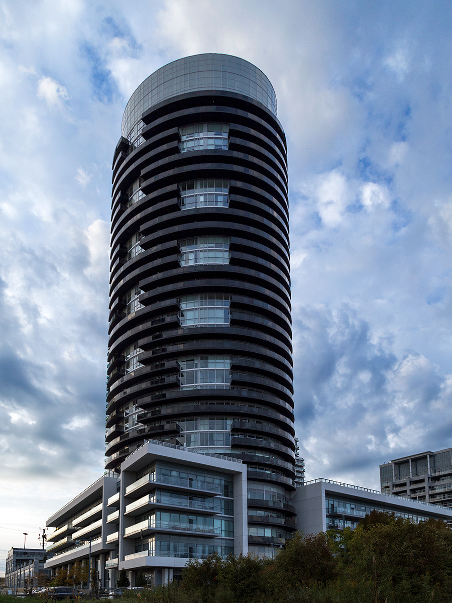 20151203. The unusual elliptical Waterscapes Condos against a dr