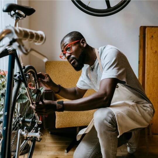 business owner fixing a bike