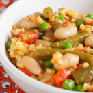 Brightly coloured vegetarian paella – a delicious and filling blend of rice, vegetables, and legumes.