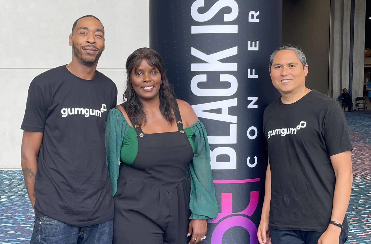 Alt Text: Three GumGum Employees Meet in Person at Tech Conference in Atlanta