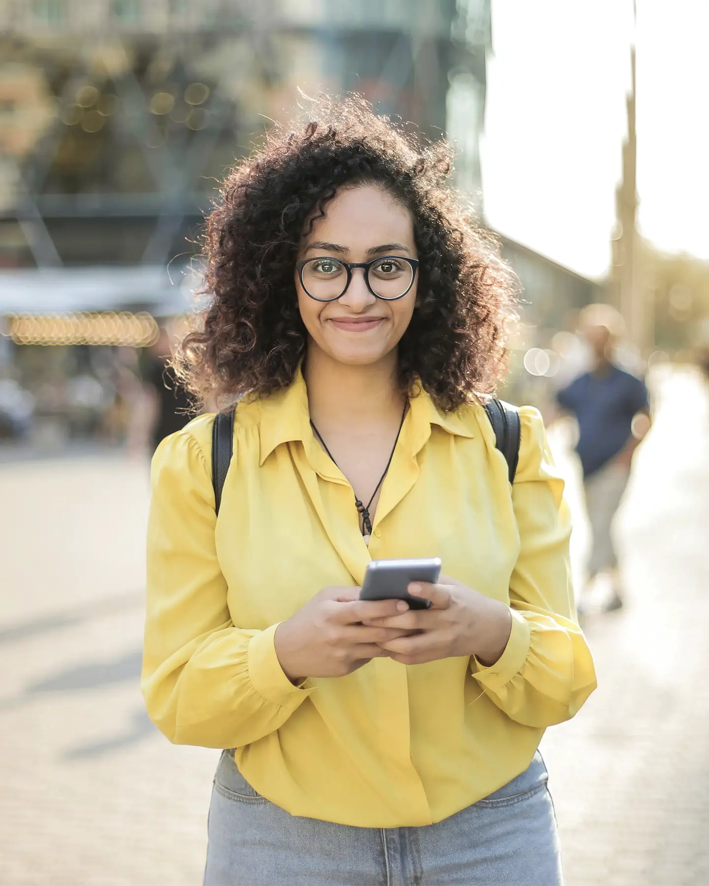 Smiling girl with phone