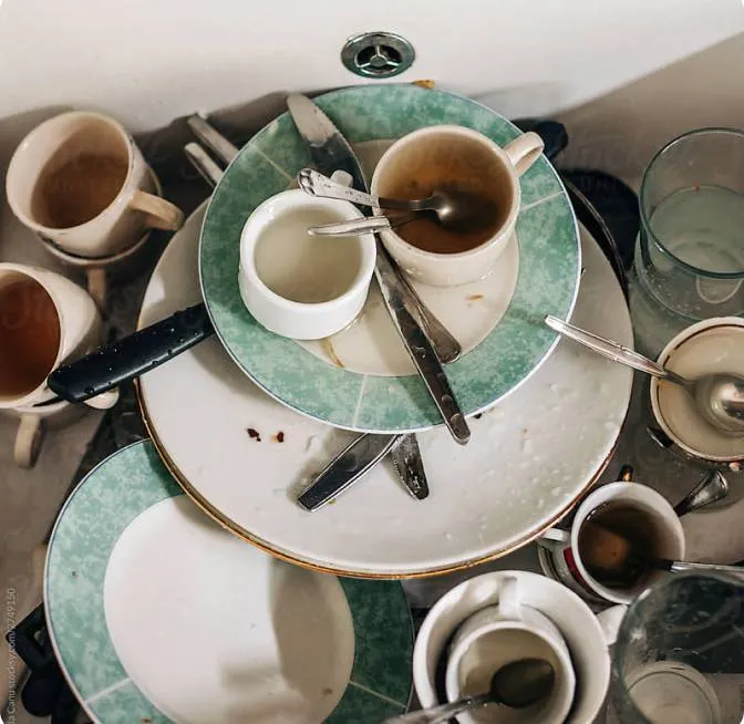 a table topped with lots of cups and saucers