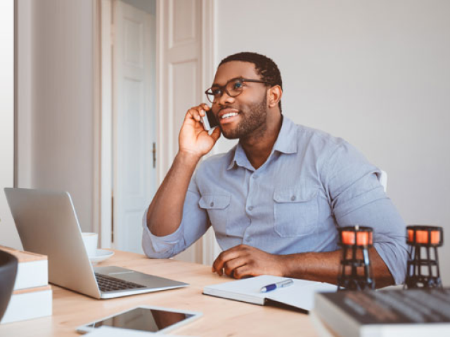 Man on phone at desk