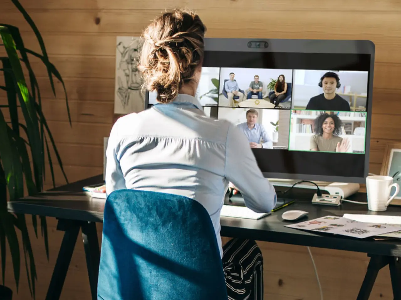 Woman in home office on zoom meeting