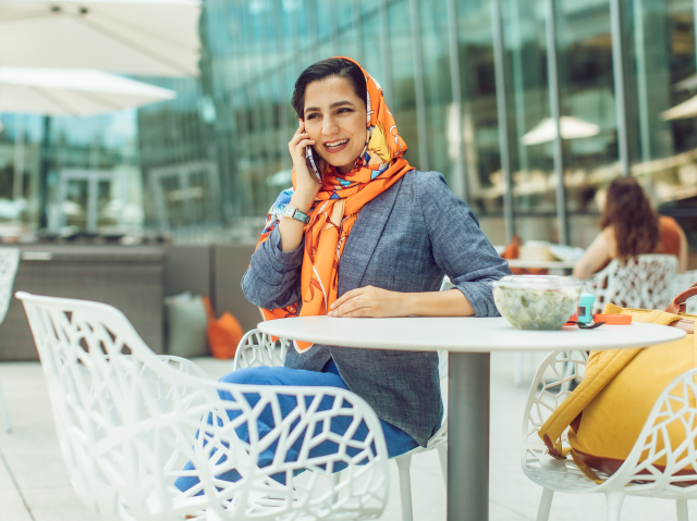 Woman on phone during lunch outside