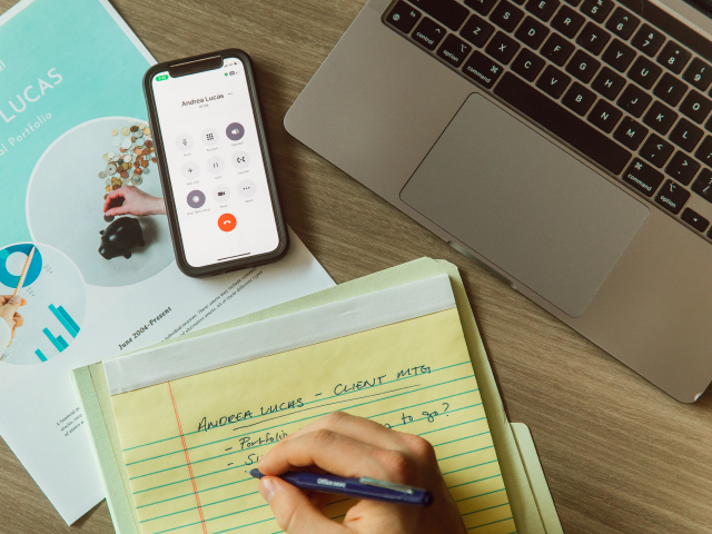 Image of a notepad and phone