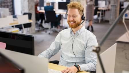 Smiling man sitting at desk