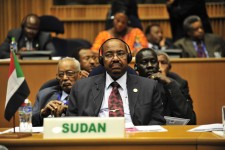 Omar Hassan Ahmad al-Bashir, president of Sudan, listens to translated remarks during the opening of the 20th session of The New Partership for Africa's Development (NEPAD)