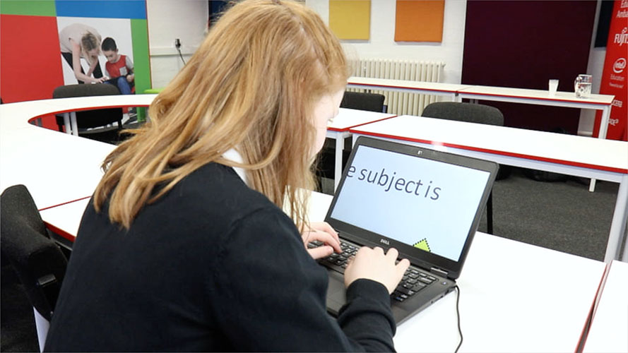 Child using computer at school