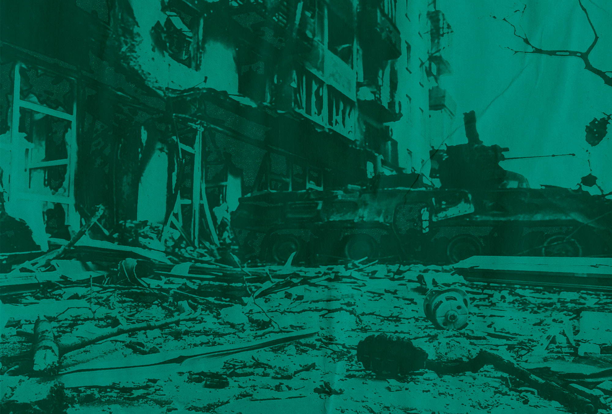 Photo of a grenade and destroyed BTR armoured vehicle likely belonging to Azov Battalion defenders lies next to a destroyed apartment complex in the port city of Mariupol, Ukraine. The photo has a teal overlay, and has been treated so that it appears to have been printed badly.