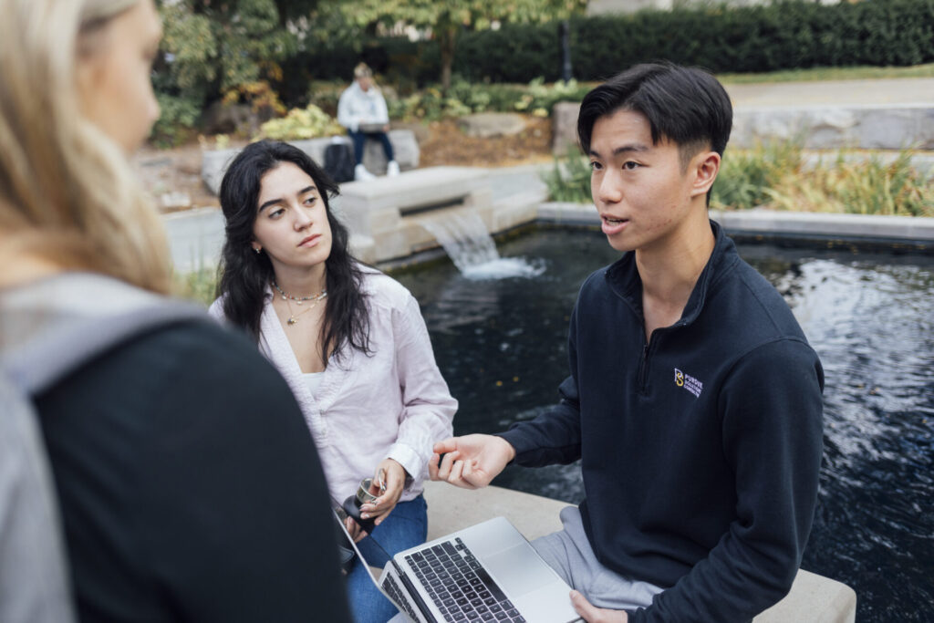 students by pond