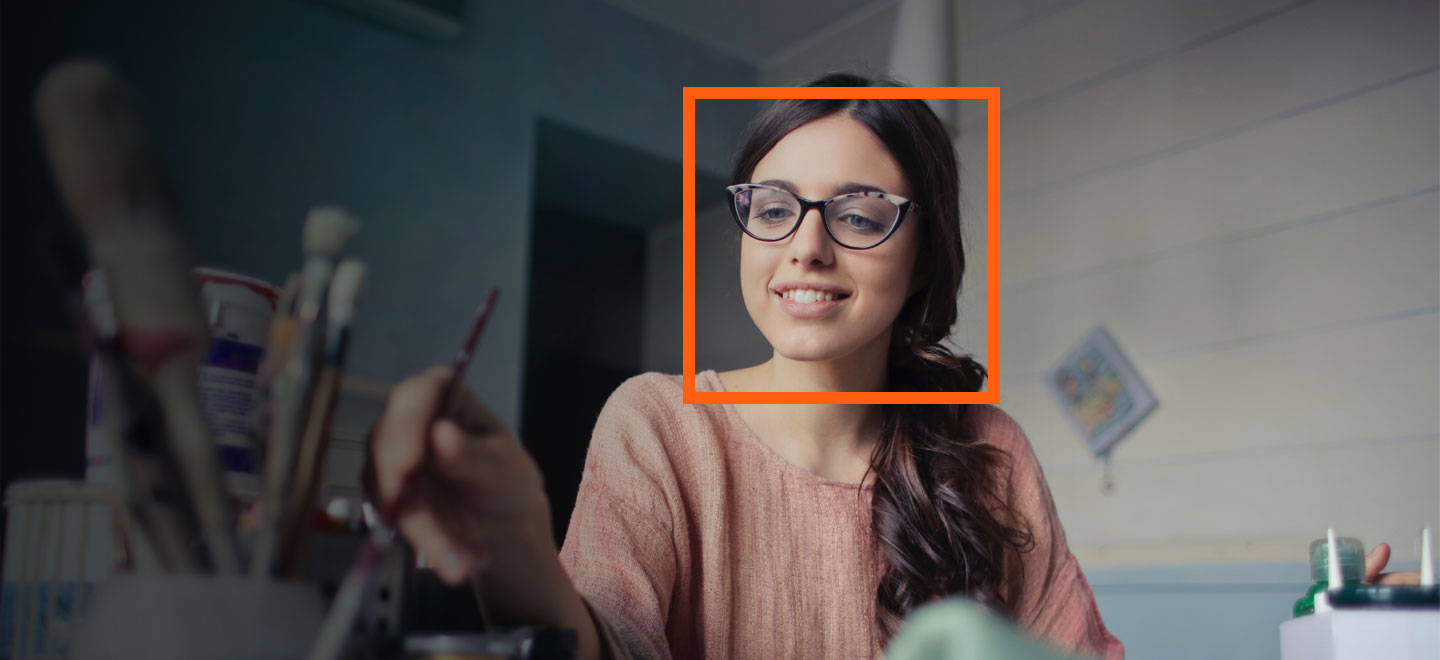 girl painting with orange square on face