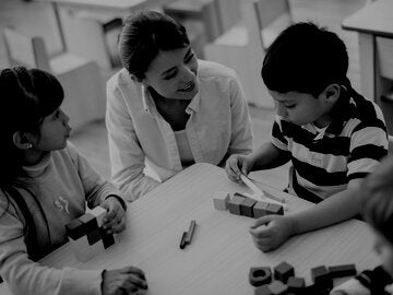 Teacher with two small children