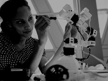 Female engineer working on robotics