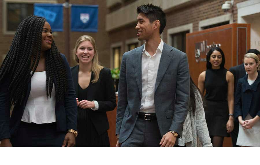 Photo of Wharton Young Alumni walking