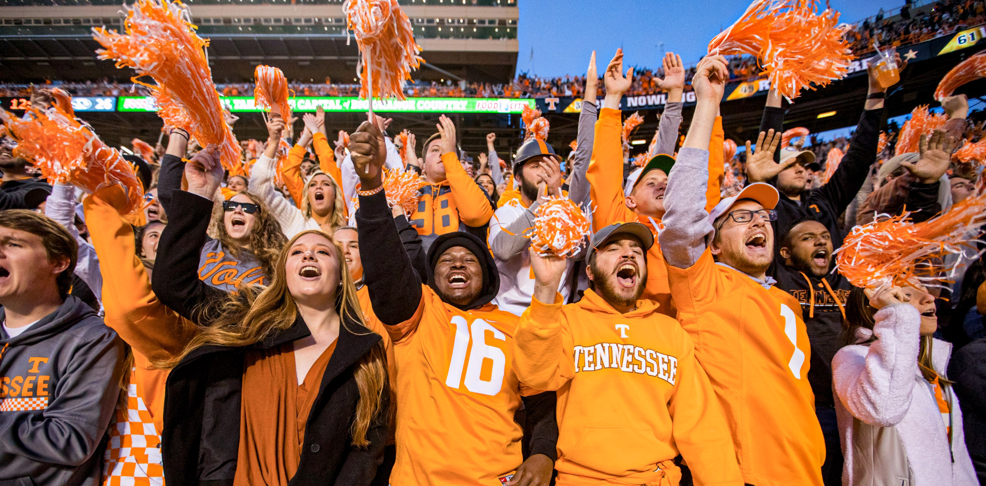 A crowd of students celebrate inside Neyland Stadium