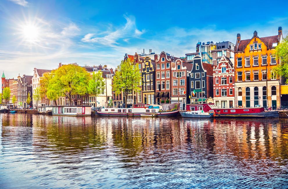 Town on waterfront with multicolour buildings.