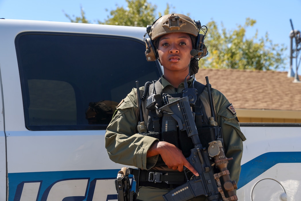 U.S. Air Force Airman 1st Class Janae Whaley, 9th Security Forces Squadron Tactical Response Team (TRT), poses for a picture in her “greens”, her TRT gear, at Beale Air Force Base, California, Aug. 27, 2024.