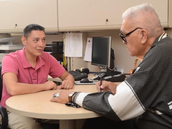 Two people sitting at a desk