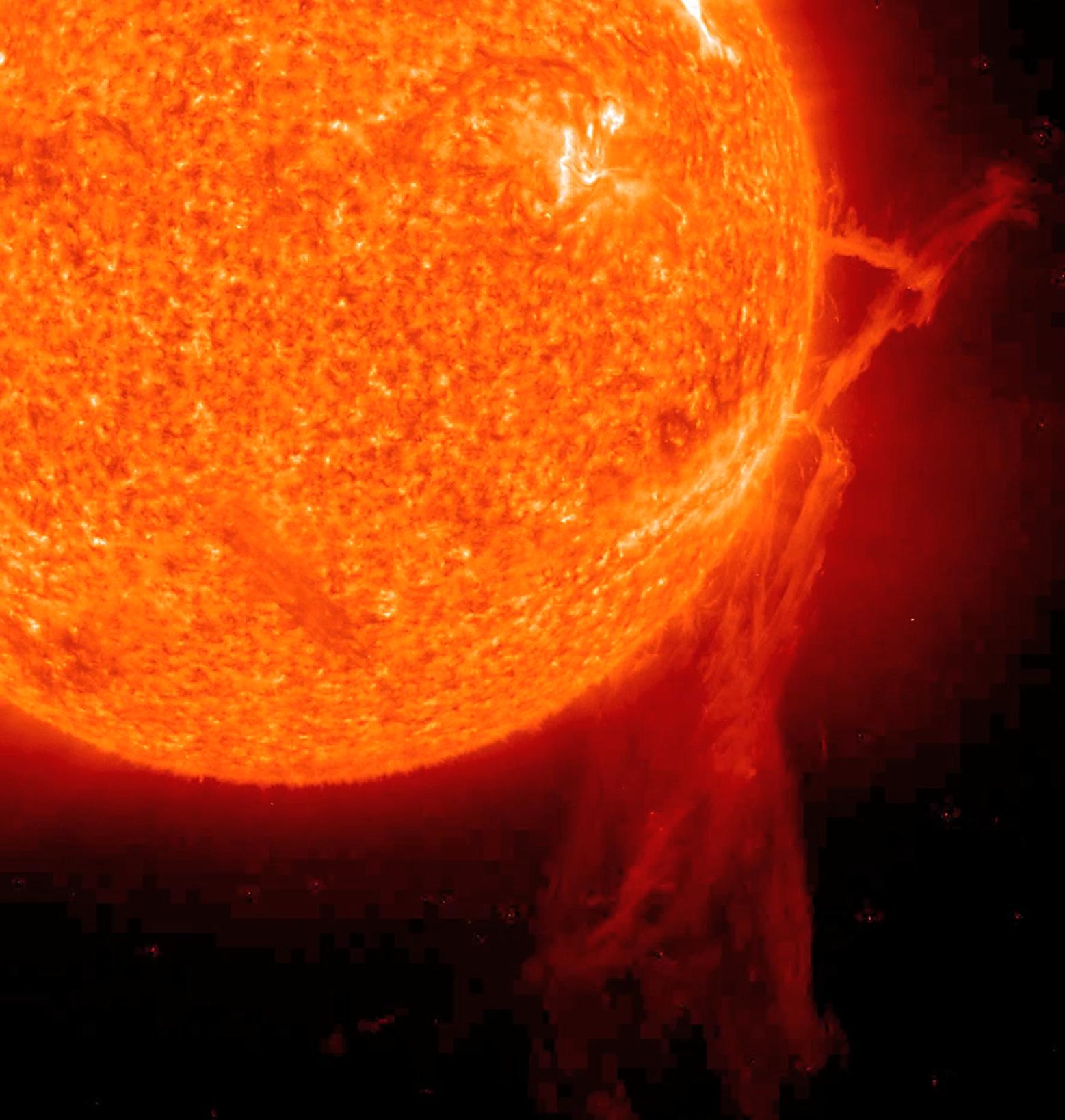 Tendrils of hot plasma stream from the Sun.