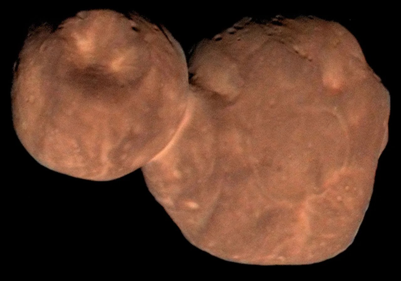 Arrokoth looks like two reddish pancakes that merged into a peanut shape.