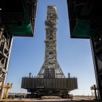 A view from inside the Vehicle Assembly Building (VAB) at NASA's Kennedy Space Center in Florida on Dec. 9, 2022, as the mobile launcher, carried atop the crawler-transporter 2, arrives at the entrance to the transfer aisle.