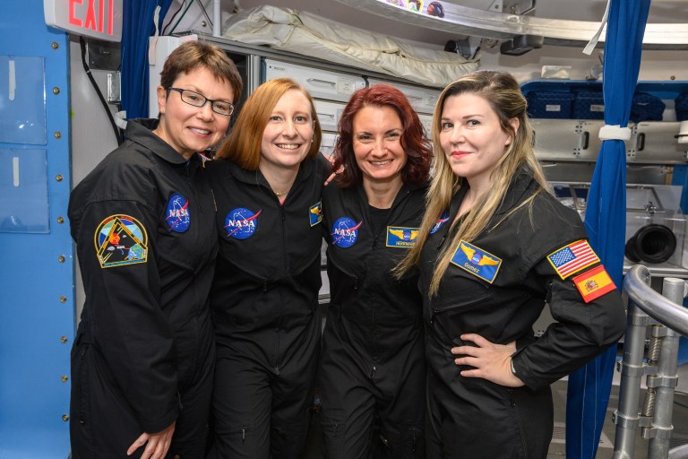 The crew of NASA's Human Exploration Research Analog (HERA) Campaign 6 Mission 4 poses for a photo together inside the habitat.