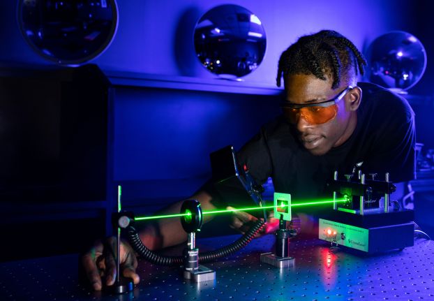 ATE student learning to measure output power from a laser