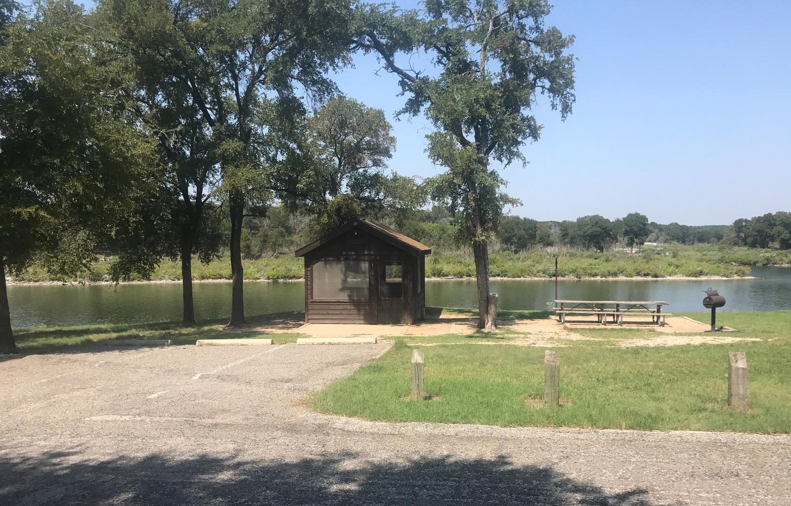 Screen shelter next to a lakeCedar Ridge (TX) Camping