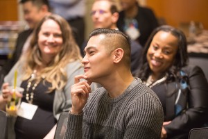 Image of four people at a partnership meeting.