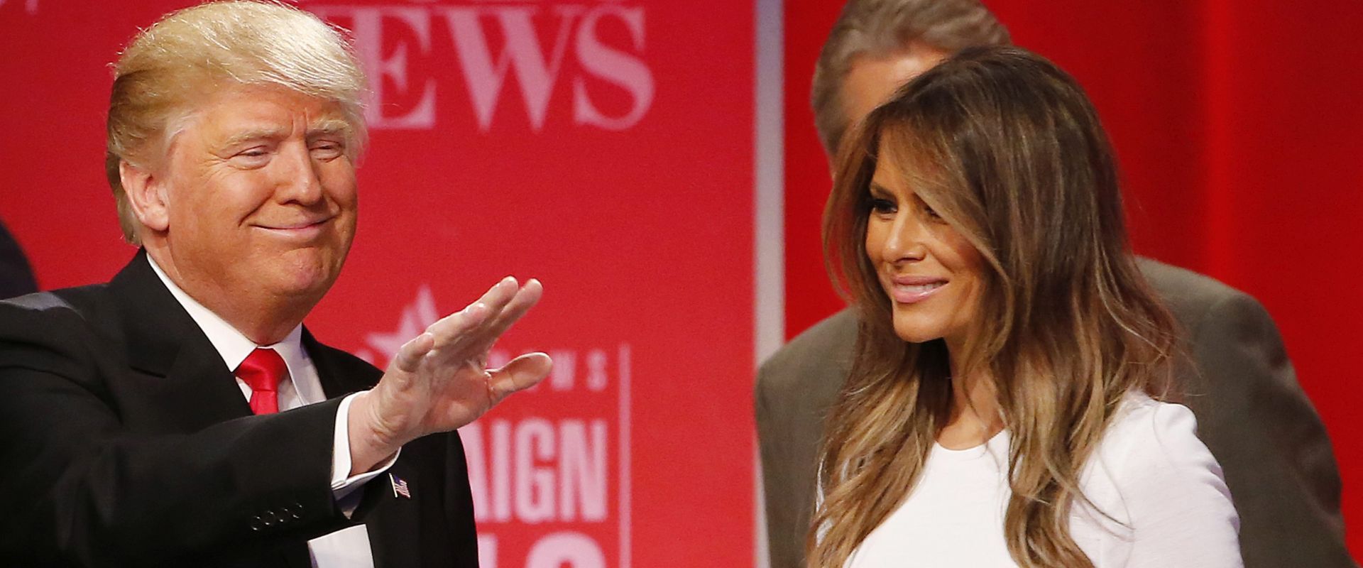 epa05159585 Republican Presidential Candidate and Businessman Donald Trump (L) waves to the crowd as his wife Melania (R) stands nearby after the Republican Presidential Debate sponsored by CBS News and the Republican National Committee at the Peace Center in Greenville, South Carolina, USA, 13 February 2016. The South Carolina Republican presidential primary is 20 February 2016.  EPA/ERIK S. LESSER