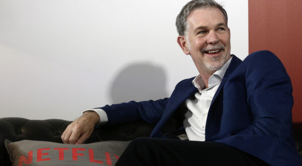 FILE - In this Feb. 28, 2017, file photo, Netflix Founder and CEO Reed Hastings smiles during an interview in Barcelona, Spain. Prominent charter school supporters are dishing out campaign money, as key gubernatorial races in several states have now begun in earnest. Hastings and philanthropist Laurene Powell Jobs donated $29,200 each, the maximum amount, to Democrat Gavin Newsom's campaign for California governor. (AP Photo/Manu Fernandez, File)