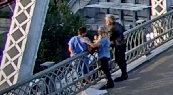 Jon Bon Jovi convinces an apparently suicidal woman not to jump from a bridge in a dramatic video., Footage shows the rocker approaching the woman as she appears to be preparing to jump off the John Seigenthaler Pedestrian Bridge in Nashville on September 10., Along with another woman, he calmly persuades her to climb back over the barrier, helping lift her to safety., The singer then helps comfort the woman, sharing a hug with her before they eventually walk away together along with some concerned onlookers., Caring Bon Jovi once again puts his arm around the woman as the group walk away together in the dramatic security camera footage from the Metropolitan Nashville Police Department., Sources told TMZ.com Bon Jovi routinely deals with people in crisis through his work with his foundation, the JBJ SOUL FOUNDATION. , He has extensive training in speaking with individuals experiencing a crisis, such as hunger or homelessness., Bon Jovi had been filming a music video on the bridge when he spotted the woman in obvious distress., Nashville PD Chief John Drake praised the star for taking swift action, saying: “It takes all of us to help keep each other safe.”, *BYLINE MUST CREDIT: Metropolitan Nashville Police Department/Mega.
10 Sep 2024
Pictured: Jon Bon Jovi convinces an apparently suicidal woman not to jump from the John Seigenthaler Pedestrian Bridge in Nashville on September 10. *BYLINE MUST CREDIT: Metropolitan Nashville Police Department/Mega.,Image: 906802207, License: Rights-managed, Restrictions: World Rights, Model Release: no, Credit line: Metropolitan Nashville Police / MEGA / The Mega Agency / Profimedia