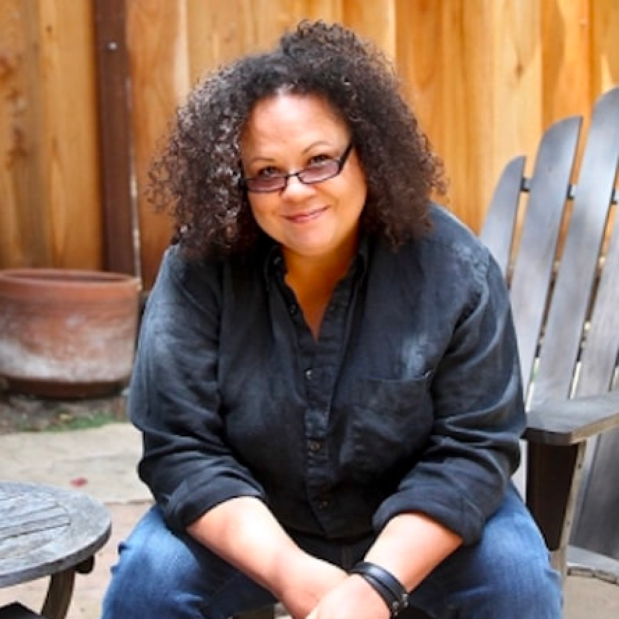 Story author, Julie Lythcott-Haims sitting in wooden outdoor chair